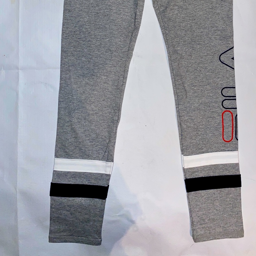 3 puma shirts girs sz. 10-12.1 pair of fila pants